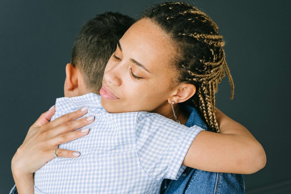 Woman comforting her son with anxiety. Tips for Helping children work through their anxiety. Brain Insights.